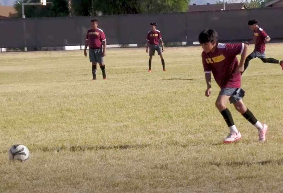 Scholars playing soccer