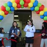 Dr. Aguilar-Lawlor and students cut ribbon for new lab