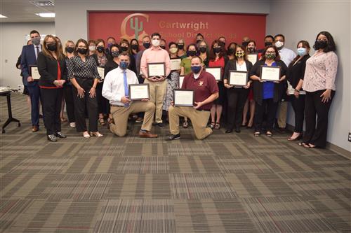 Staff members accepting awards