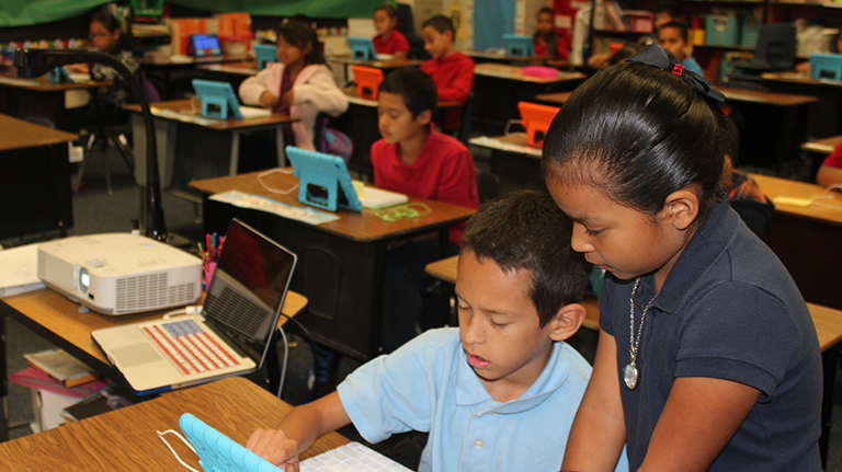 Students using an iPad