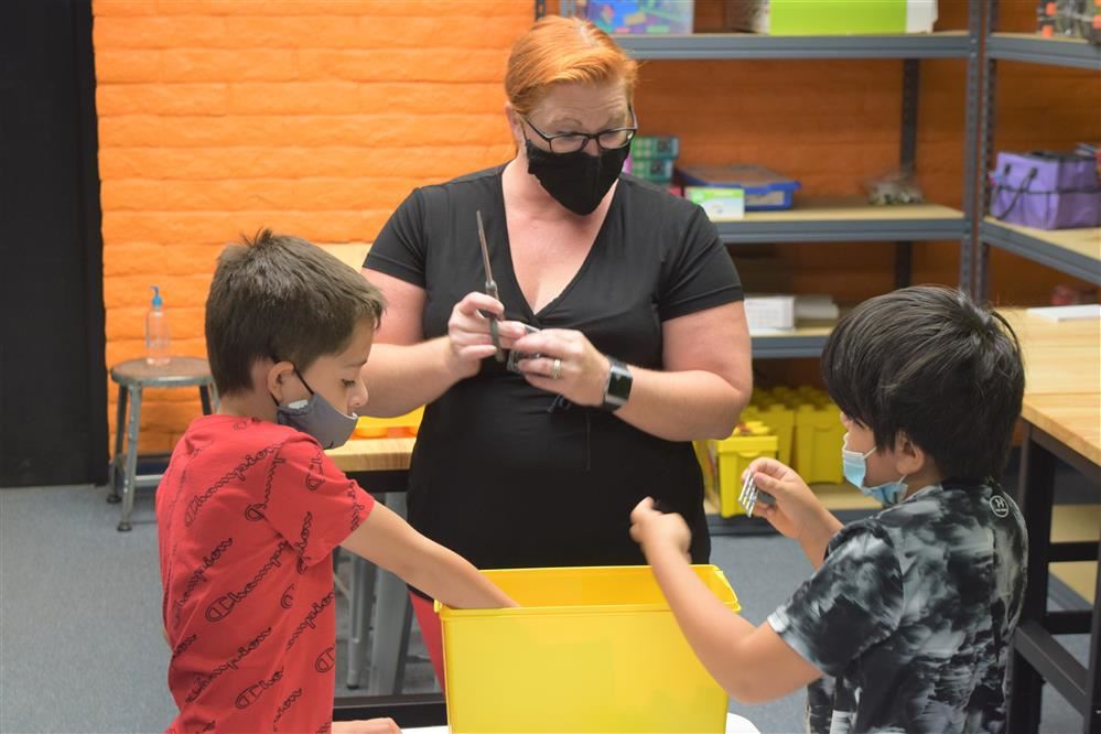 Teacher instructing scholars